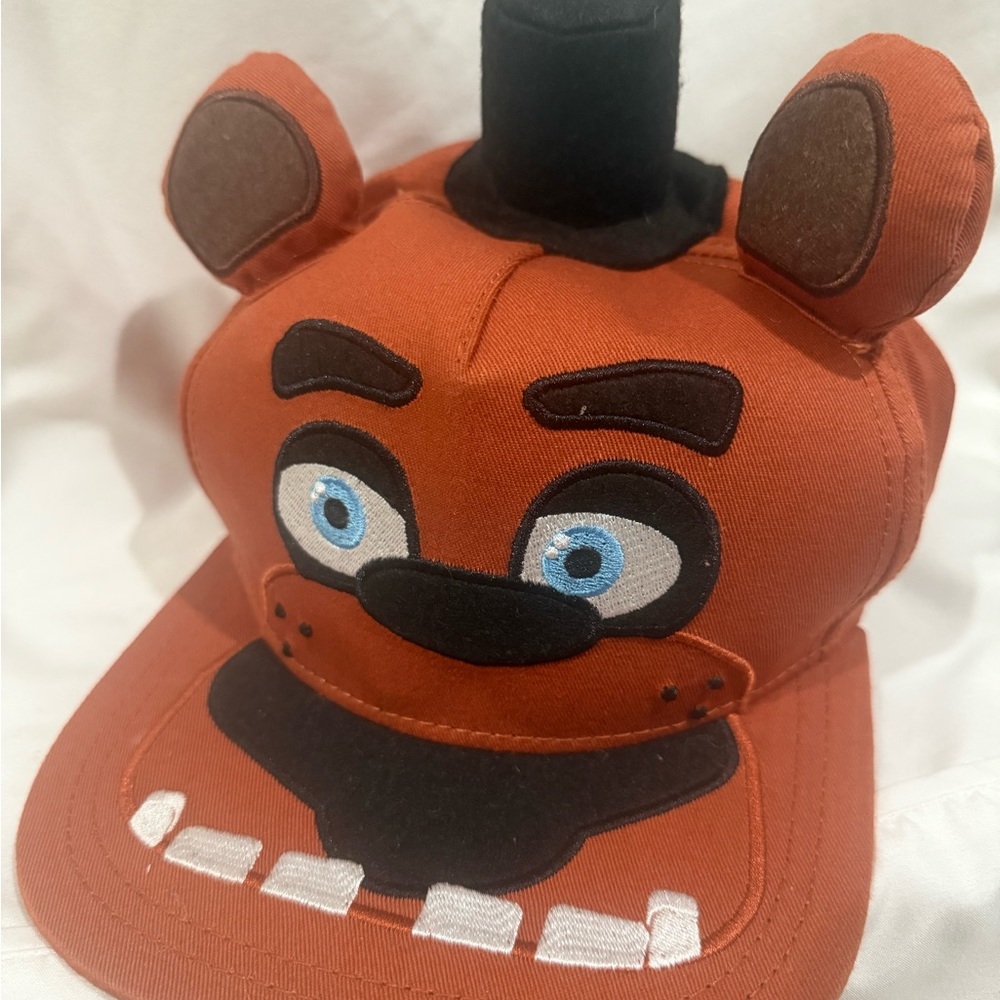 Vibrant Orange and Black Character Hat